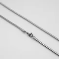 Detailed macro view of silver snake chain necklace with secure lobster clasp closure - Thin Snake Chain / Steel