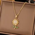 Golden sunflower necklace featuring emerald green leaf accents and a zircon-paved center - Sunflower