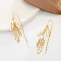 Elegant gold hollow leaf drop earrings with long tassel fringe and hook style design - Hollow Feather Tassel Drop Earrings (A-1176) / Gold