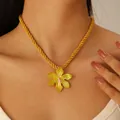 Exaggerated gold flower pendant necklace with pink center and textured petals - Yellow Twist Rope Necklace