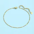 Dettaglio ravvicinato della cavigliera dorata in acciaio inossidabile con lustrini metallici - Stile Disco con Motivo a Stella (JL60006) / Oro