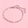 Detailed macro view of stainless steel chain bracelet with lobster clasp and extension chain - Silver Tiny Disc Style (SL60025-Silver) / Silver