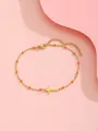 Goldenes Edelstahl-Armband mit Kreuzanhänger und orangefarbenen Perlen, verstellbar - Orange