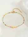 Vue détaillée du bracelet en perles dorées avec perles émaillées et pendentif croix - Style Croix Horizontale / Multicolore (Style 2)
