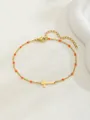 Bracelet doré avec croix et perles orange sur fond blanc avec texture douce - Style Croix Horizontale / Orange (Style 2)