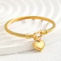 Gold-plated stainless steel twisted cable cuff bracelet with polished heart charm - Heart Style / Gold