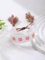 White woven bracelet featuring pink flower embroidery and colorful tassel drawstring - White Floral Style / White