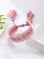 Pink woven tassel bracelet featuring silver studded FAMILY letter embroidery detail - Pink FAMILY Style