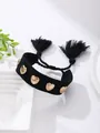 Adjustable black woven bracelet featuring golden heart studs and decorative tassels - Black Heart Style