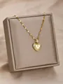 Elegante collar con colgante de corazón dorado y circonitas en cadena de eslabones - Corazón Estrellado 3D (1)
