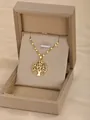 Golden Tree of Life necklace with colorful gemstones in a warm gift box setting - Tree of Life