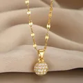 Macro shot of a gold-plated spherical pavé pendant with sparkling zircons on a ribbon chain - Gold Sphere Pave Style(25)