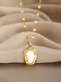 Detail of gold necklace with oval mother of pearl pendant on elegant silk fabric - Gold Oval Mother of Pearl Style(27)