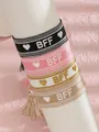 Detalle de cuatro pulseras de la amistad tejidas con texto BFF y adornos de borlas - Estilo de Set BFF Negro (42-Negro)