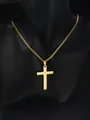 Close-up of golden cross pendant with engraved Lord's Prayer on a cuban chain - Gold