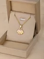 Golden necklace with cream enamel scallop pendant presented in an elegant jewelry box - Scallop-Orange