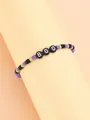 Detalle de una pulsera elástica de Halloween con cuentas de color púrpura, verde y letras BOO - Púrpura Negro Verde Letra BOO
