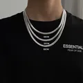 Close-up of three layered silver steel NK chains in lengths of 50cm, 55cm, and 60cm on a model - 5.8 Wide 45 Long / Silver