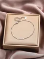 Elegant silver stainless steel tassel bracelet with textured discs on a silk background - Silver Fine Chain with Engraved Discs (SL60013-Silver) / Silver