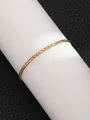 Golden Figaro chain bracelet with polished finish on a white jewelry display stand - Gold Figaro Chain Style (SL60063-Gold) / Gold