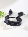 Bohemian woven friendship bracelet in dark grey featuring black Believe embroidery and tassels - Dark Gray-BELIEVE