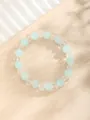 Elegante pulsera de cuentas con cristales tallados en verde menta y claro sobre fondo beige - Facetado Mate Azul Claro Mezclado (10-Azul Claro)