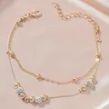 Double-layer rose gold beaded anklet with rhinestones on elegant pink silk background - KC Gold Frosted Rhinestone Ball Style (9695)