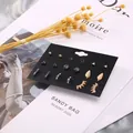 Detailliertes Set aus 9 Paaren geometrischen Ohrsteckern in Gold und Silber mit Zirkon - Mode Geometrische Legierung