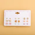 9 pairs of gold and pink earrings with flowers, stars, and pearls on a white display card - Pearl Star Flower Butterfly 9 Pairs Stud Set