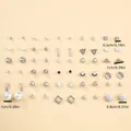 Detail van diverse geometrische oorknopjes met maten tussen 0,5 cm en 1 cm - Minimalistische Geometrische Oorbellen Set (FX050938)