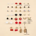 Gedetailleerd overzicht van gouden oorbellen met parels, harten en rozen met afmetingen - Kerstthema Element Oorbellen Set (FX050936)