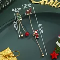 Asymmetric Christmas earrings featuring festive Santa on sleigh and green glittery tree - Asymmetric Santa Claus (SD61315)