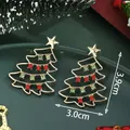 Sparkly Christmas tree earrings with red and green rhinestones on festive background - Red Green Rhinestone Christmas Tree (SD61323-Red Green)