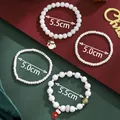 White Christmas beaded bracelet set featuring snowman and glove charms on holiday background - White Christmas Theme Bracelet(SD61360)