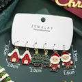 Christmas earring set with Santa Claus, snow house, and tree motifs on a display card - Santa Claus Christmas Tree (SD61342)