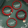 Christmas beaded bracelet set with Santa Claus and reindeer charms on green background - Red Christmas Beaded Bracelet(SD61357)