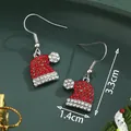 Sparkling Christmas hat earrings with red and white rhinestones on green background - Rhinestone Inlaid Santa Hat (SD61336)