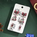 Three pairs of Christmas stud earrings featuring Santa and bows on a white card - Sunglasses Santa Claus (SD61385)