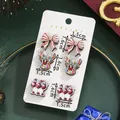 Christmas stud earring set featuring bows and reindeer on a white display card - Bow Reindeer Combination (SD61378)