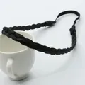 Detailed view of black braided synthetic hair headband with elastic strap on ceramic cup - Braid Headband / Five-Piece Set / Black (5081)
