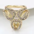 Close-up of gold-plated silk scarf ring with rhinestones and hollow geometric pattern - Gold Rhinestone (Geometric Hollow)