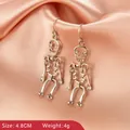 Gothic silver skeleton earrings with sparkling rhinestones for Halloween party wear - Skeleton Shape