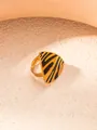 Detailed view of an adjustable gold-plated ring with a triangular zebra print motif - Triangle Zebra Print Ring