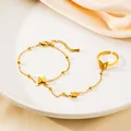 Detail of gold butterfly slave bracelet with frosted texture wings and bead chain - Frosted Butterfly Style