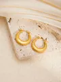 Detailed macro view of gold-plated stainless steel hoop earrings with hammered texture - Round E0265 Style