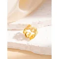 Adjustable golden stainless steel ring featuring detailed butterfly patterns on stone - Butterfly Design / Gold