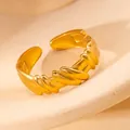 Macro shot of gold-plated twisted woven texture on an adjustable open ring - Spiral Wave Texture (#0230)
