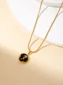 Collier doré élégant doté d'un pendentif rond noir avec un motif de rose en relief doré - Pendentif Rose Noire