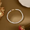 Elegante bracciale tennis placcato oro con cristalli rotondi scintillanti e chiusura a scatto - Oro