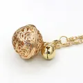 Elegant gold hollow ball pendant with bell and fine chain for a stylish jewelry look - Gold